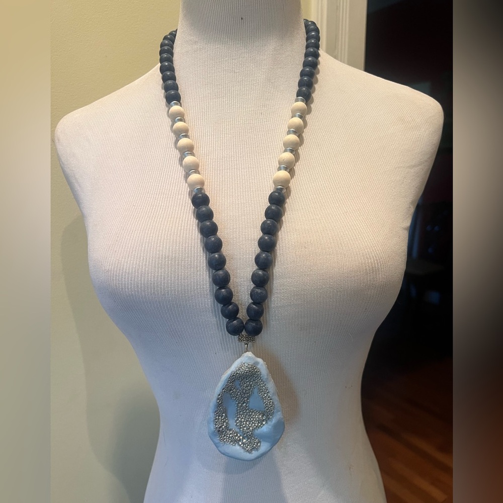 Handmade wooden, oyster shell, and resin necklace. Navy blue and off white beads